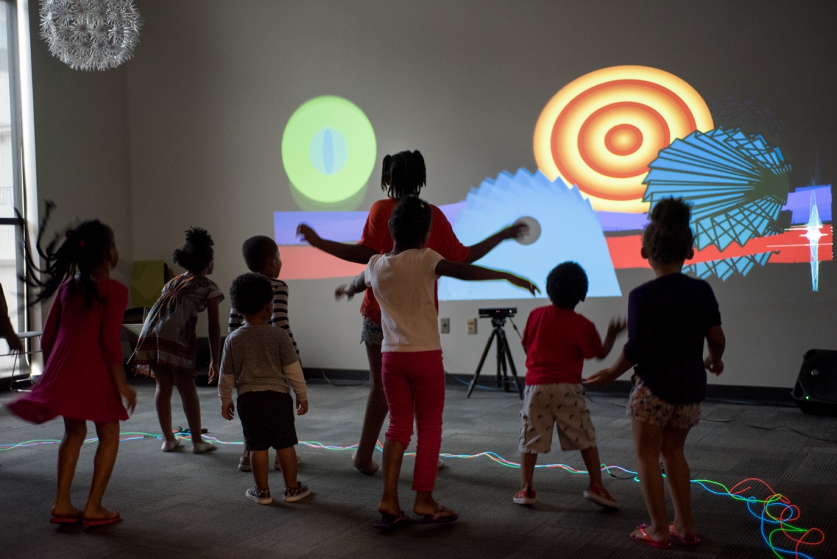 Participants work together using body movement to create musical composition through the interactive video animation project “Constellation” by artist Robbie Lynn Hunsinger. “Constellation” was one of eleven public art projects funded through Metro Nashville Arts Commission’s Learning Lab Artist Training Program in 2017. Photo by Stacey Irvin. 