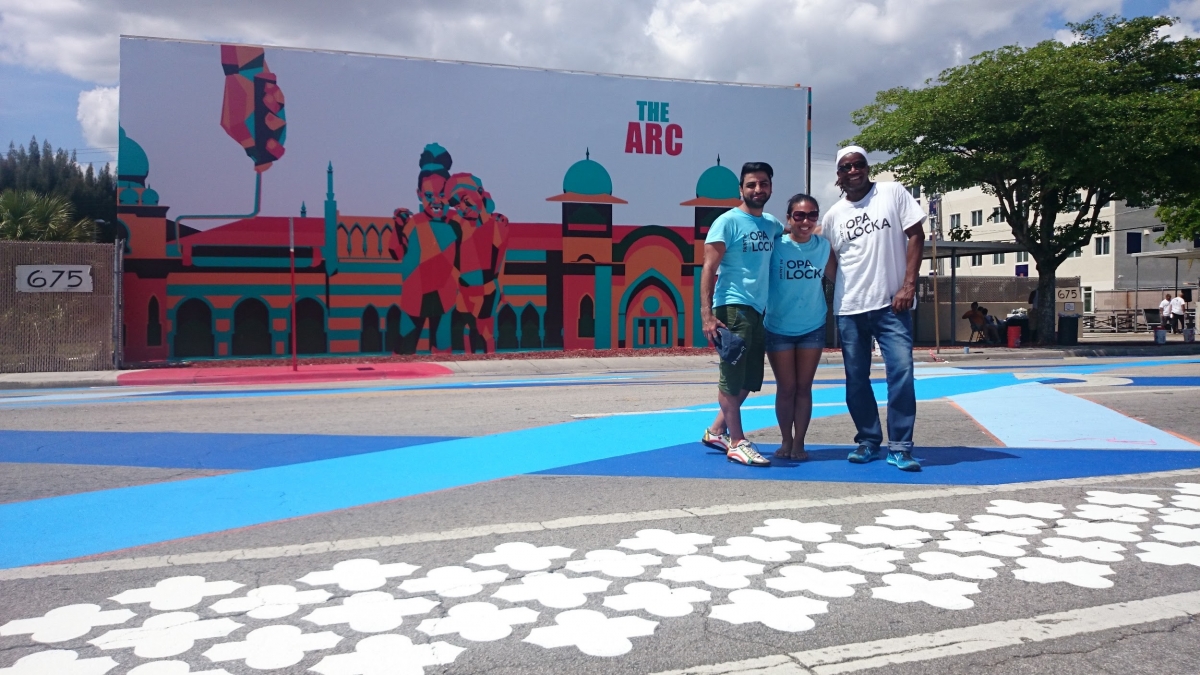 L-R: Artist Amir Baradaran, Aileen Alon, & artist/architect Walter Hood after completing a Community Paint Day, a partnership between OLCDC, Hood Design, City of Opa-locka, Miami Rise, Greater Miami Chamber of Commerce, local businesses, and over 200 residents and volunteers to paint the street and bike lane along Ali Baba Avenue. Copyright OLCDC, 2015.