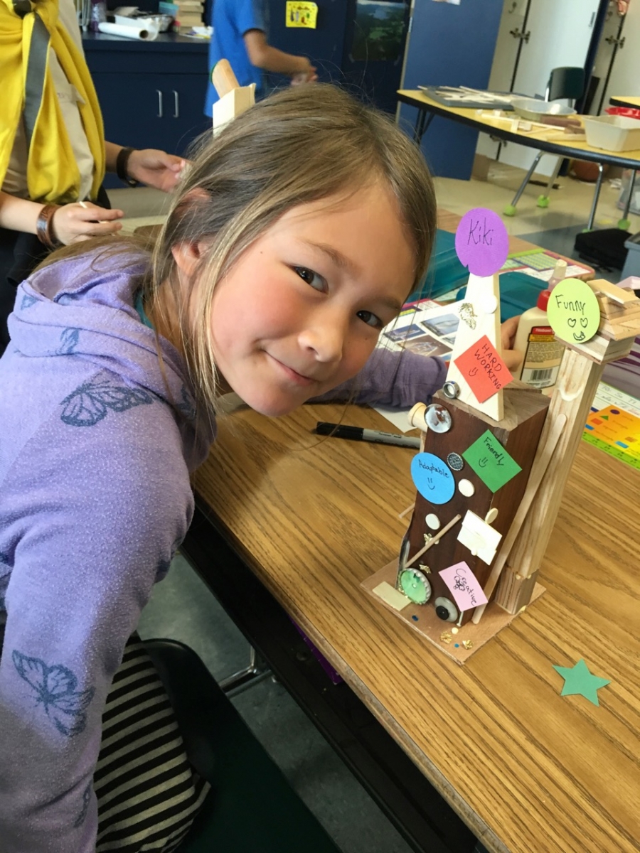 Youth in Arts architecture student shows her “Tower of Power.” Photo by Shirl Buss.