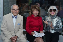 Harry Kullijian, Congresswoman Jackie Speier, and Carol Channing review the congressional resolution. Image by Jamie L. M